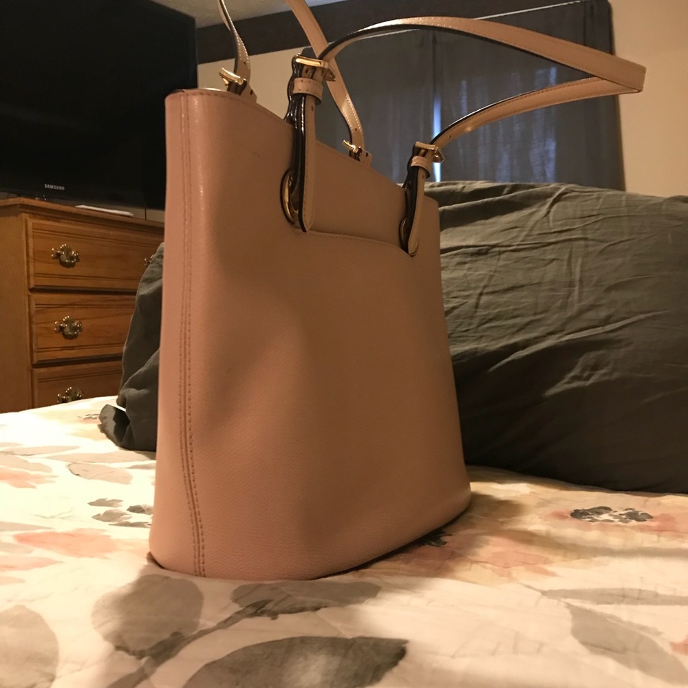 Michael Kors. Willing to negotiate on price.